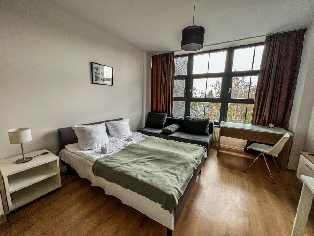 Giường trong phòng chung tại Apartment by Park Biznesowy