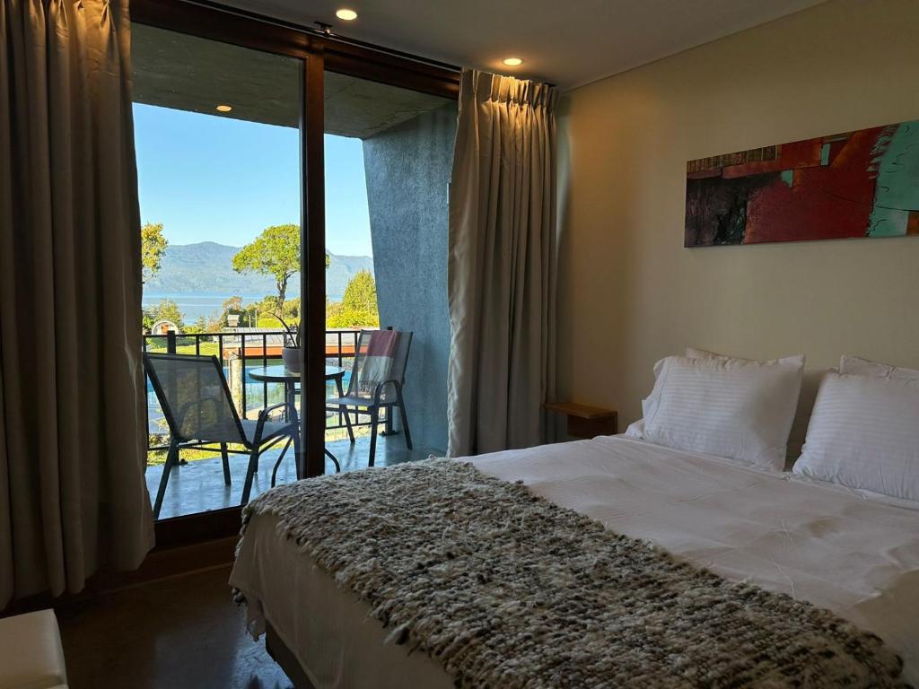 Postel nebo postele na pokoji v ubytování Apart Hotel Sol y Lago