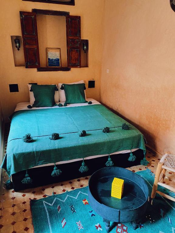 Postel nebo postele na pokoji v ubytování Riad Sidi Radoine