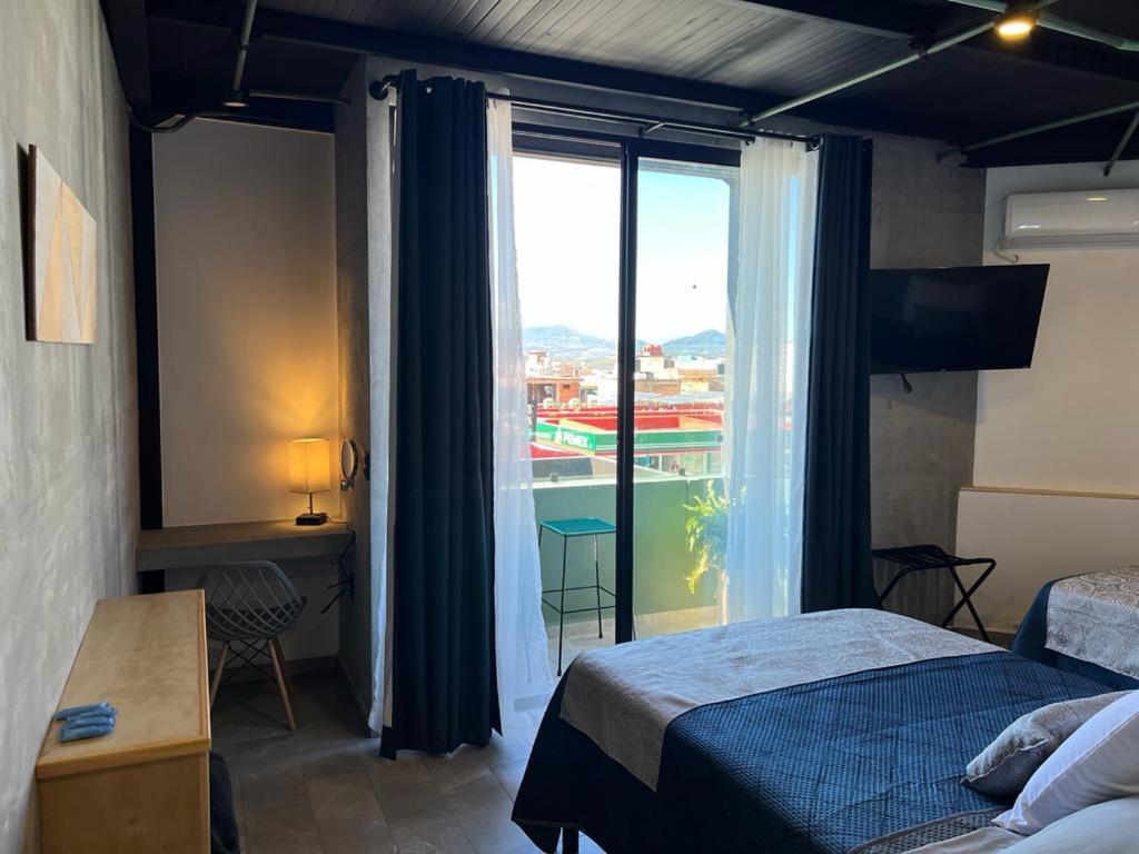 Postel nebo postele na pokoji v ubytování Hotel Ciclovía & Terraza