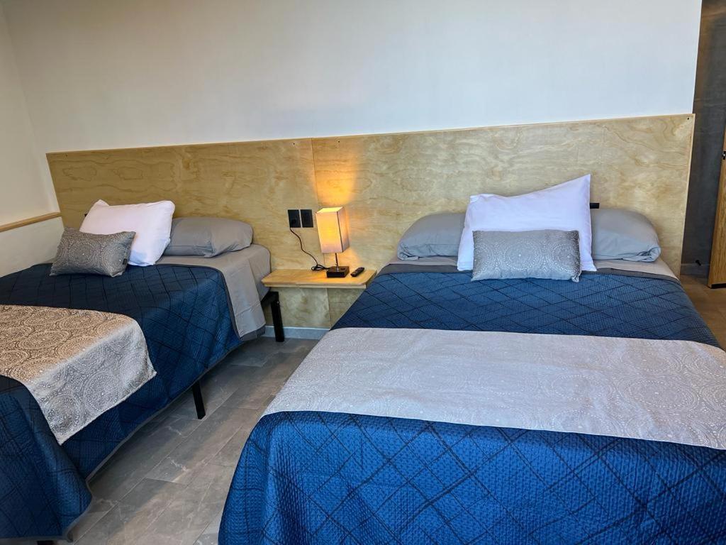Postel nebo postele na pokoji v ubytování Hotel Ciclovía & Terraza