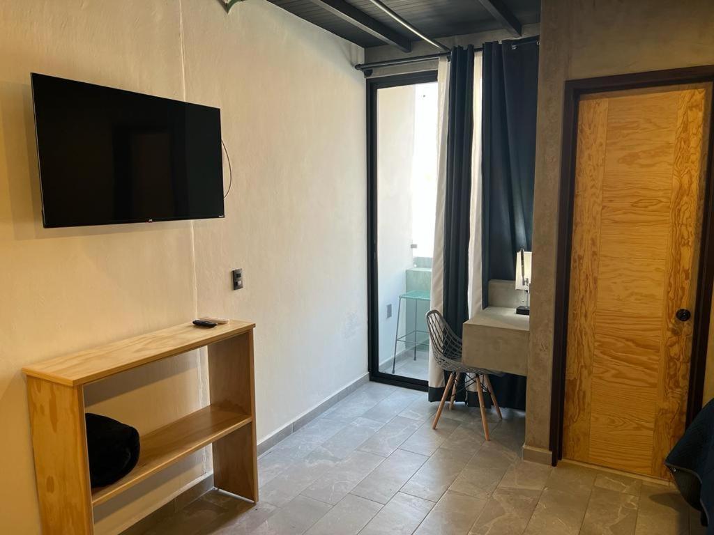 TV a/nebo společenská místnost v ubytování Hotel Ciclovía & Terraza
