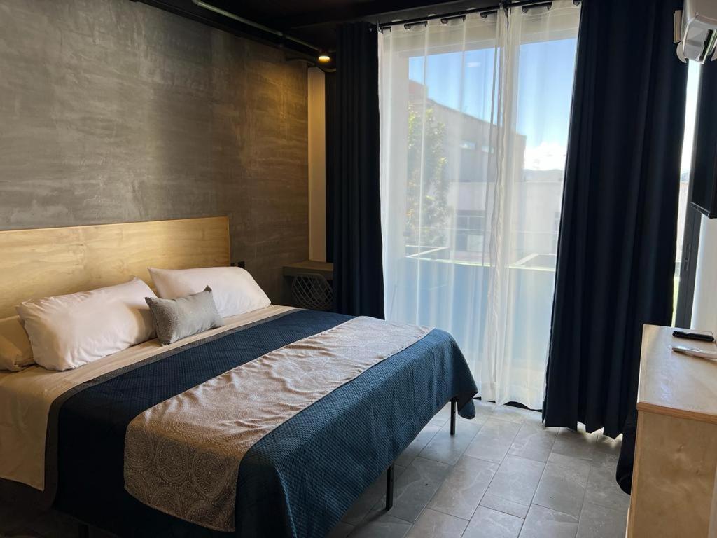 Postel nebo postele na pokoji v ubytování Hotel Ciclovía & Terraza