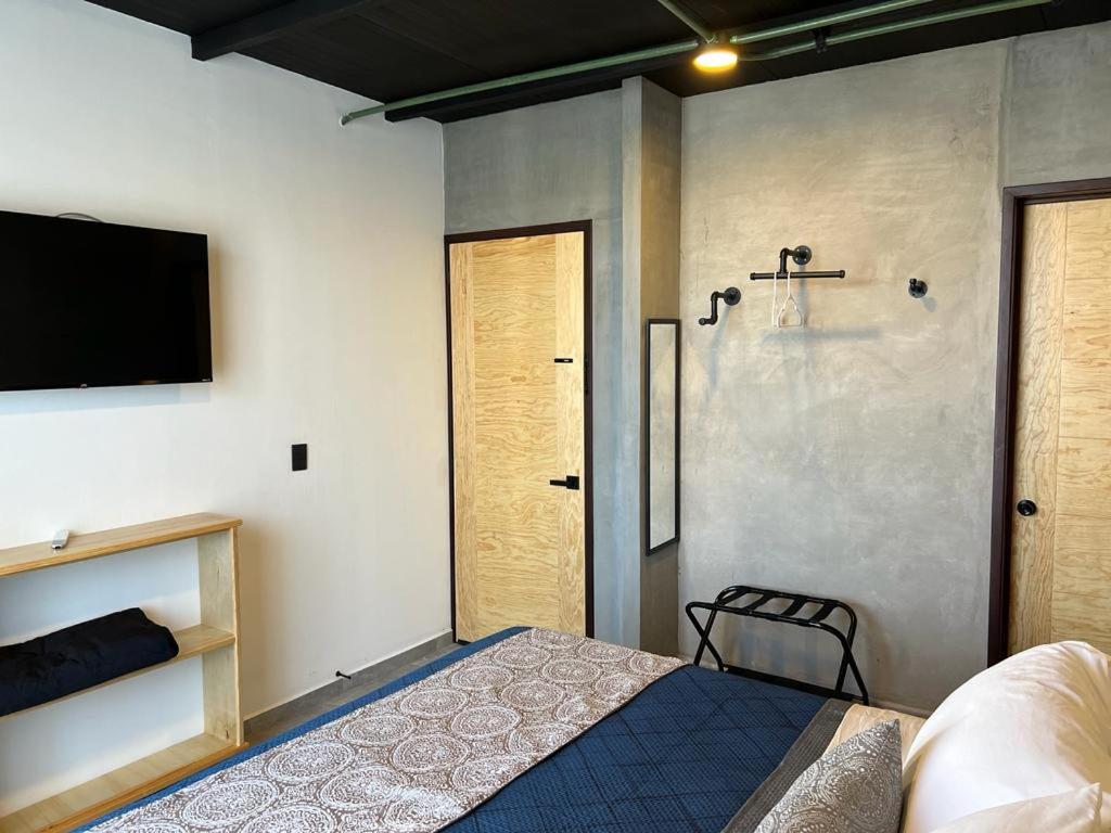 Postel nebo postele na pokoji v ubytování Hotel Ciclovía & Terraza