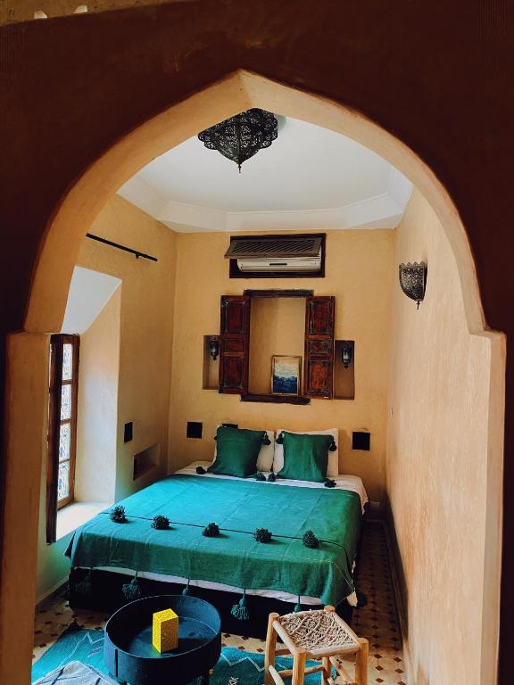 Postel nebo postele na pokoji v ubytování Riad Sidi Radoine