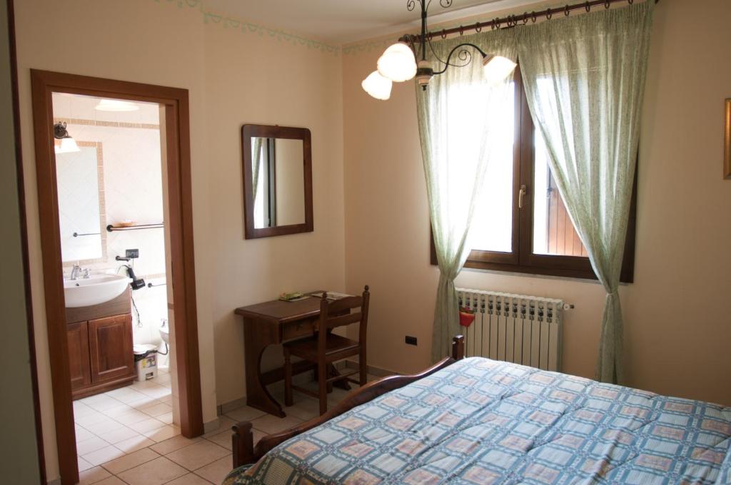 A bed or beds in a room at Azienda Agrituristica Salella