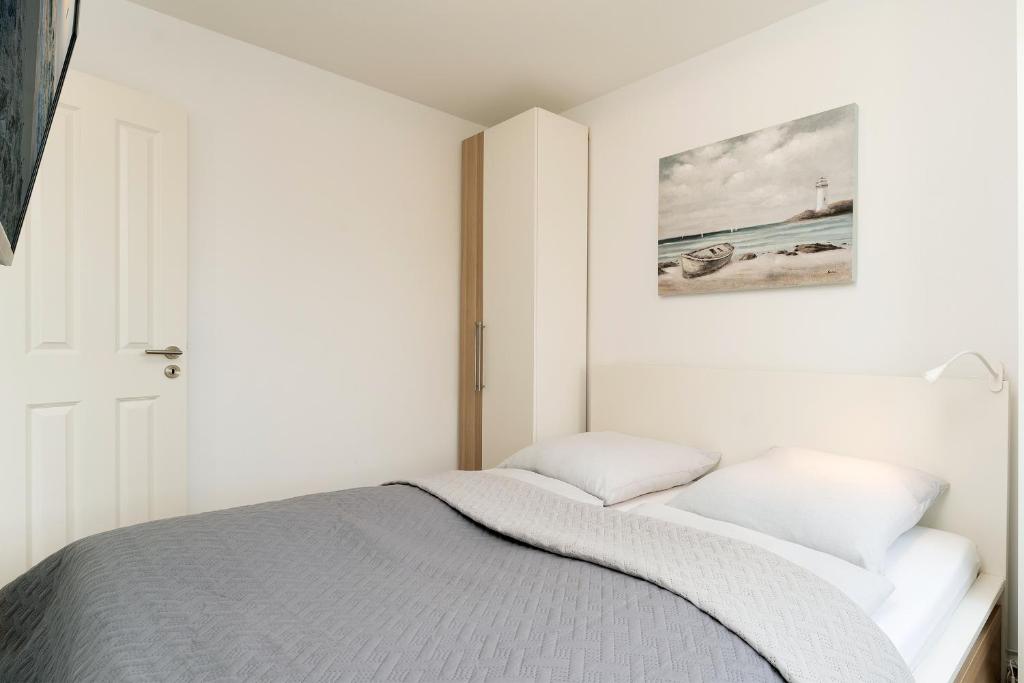 Postel nebo postele na pokoji v ubytování Höppnerweg 5 Seemöwe 18
