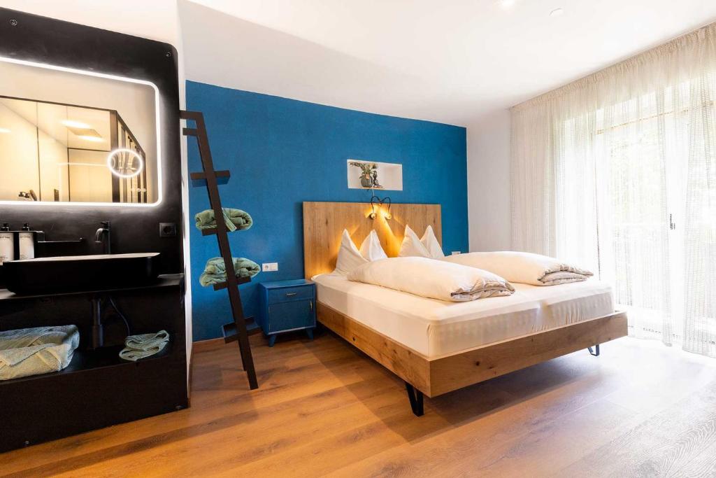 Postel nebo postele na pokoji v ubytování Michlhaus nature and suites