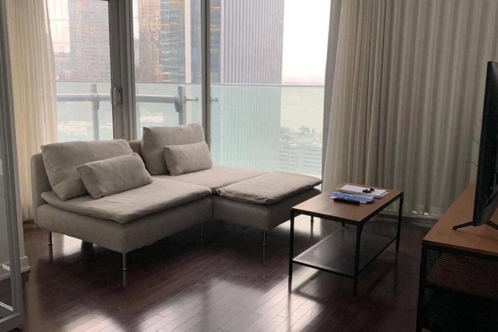 a living room with a couch and a table at Home Away From Home in Toronto