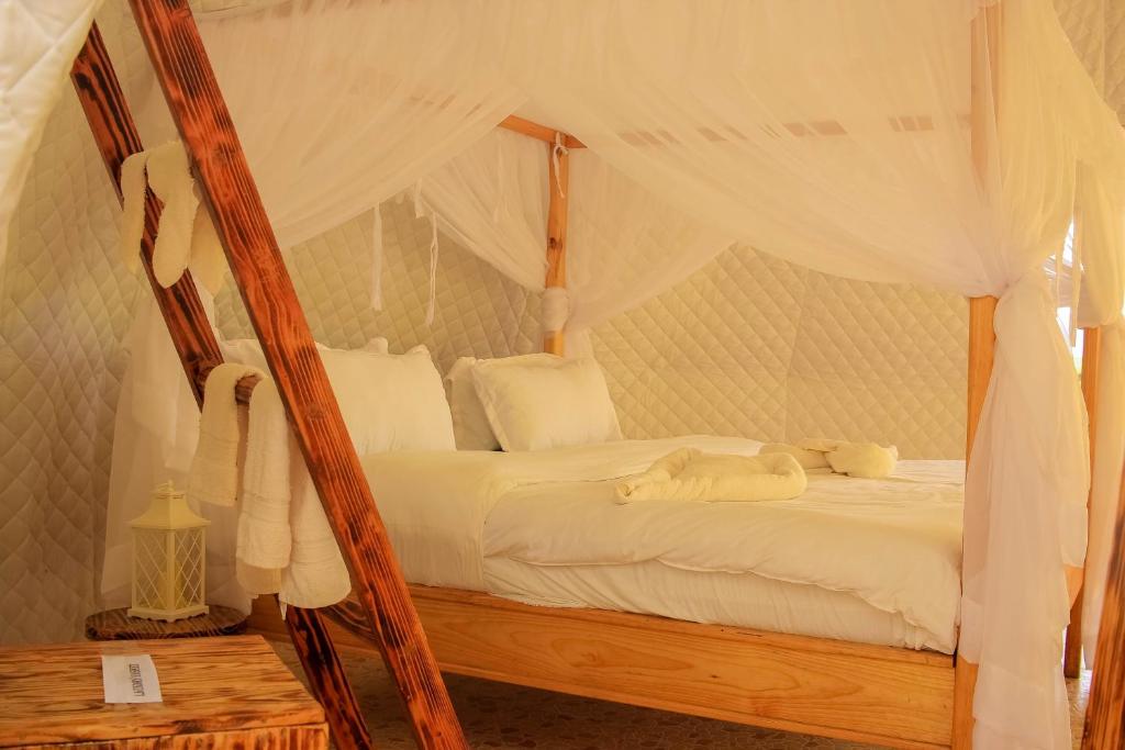 Postel nebo postele na pokoji v ubytování Little Amanya Camp