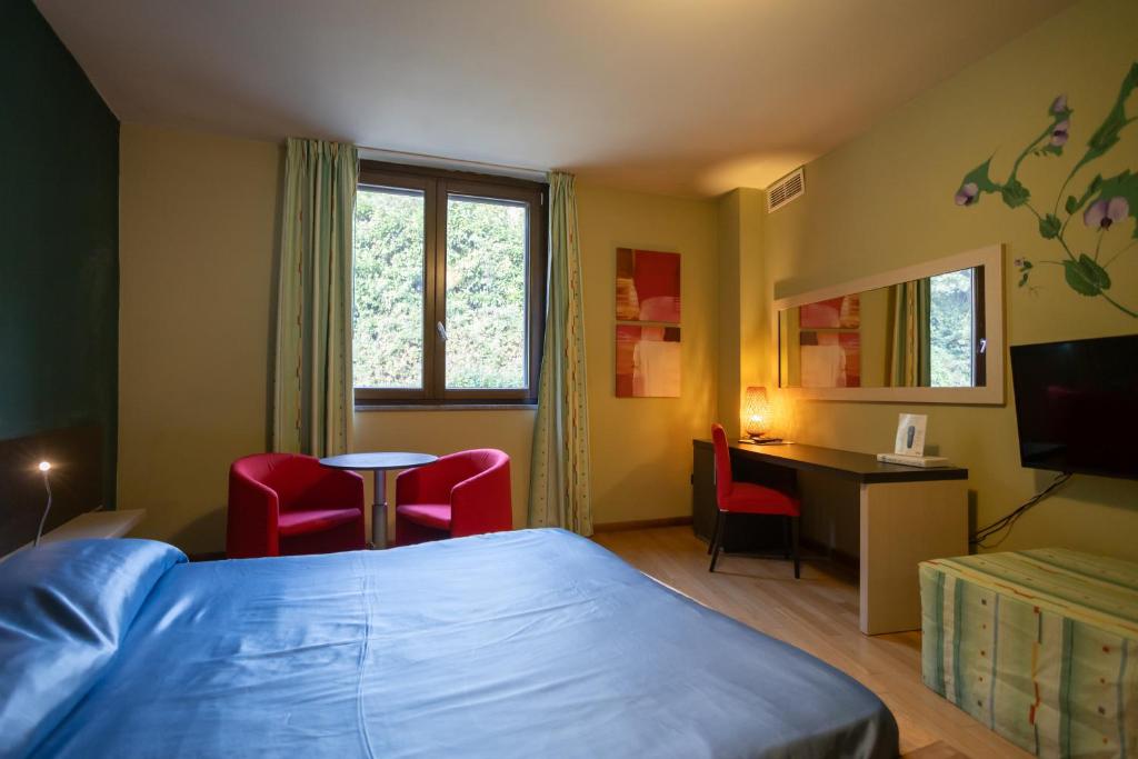 Postel nebo postele na pokoji v ubytování Sotto Il Cielo Hotel