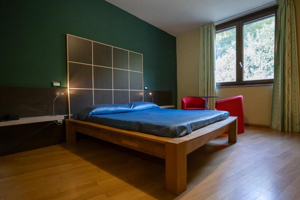 Postel nebo postele na pokoji v ubytování Sotto Il Cielo Hotel