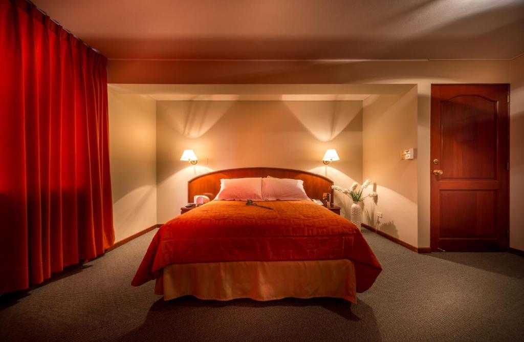 Postel nebo postele na pokoji v ubytování Hotel Park Suites