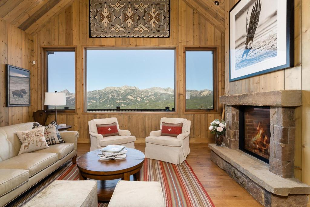 a living room with a fireplace in a cabin at 5 Bandit Way by Moonlight Basin Lodging in Big Sky
