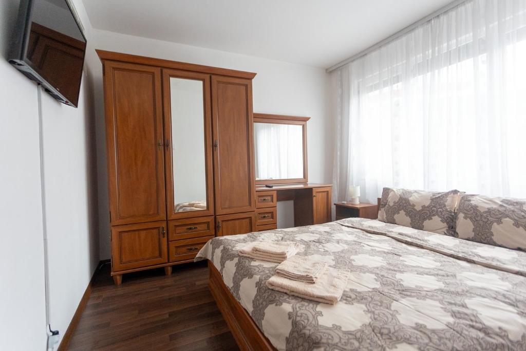 Postel nebo postele na pokoji v ubytování Karastoyanovi's apartment 3