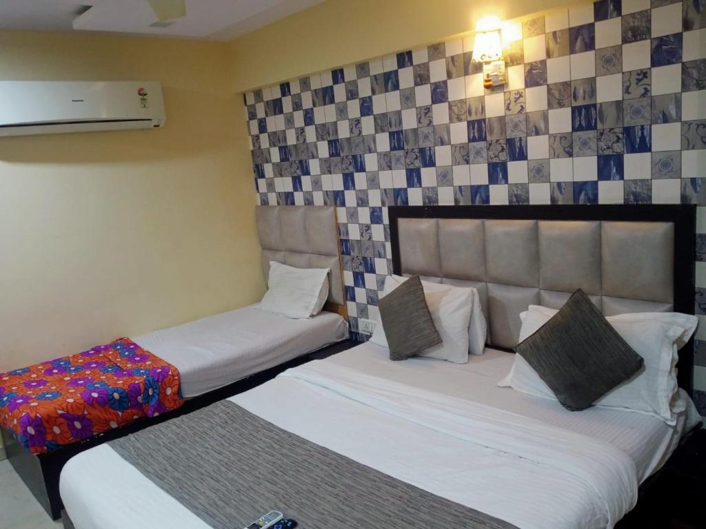 Postel nebo postele na pokoji v ubytování HOTEL DREAM INN