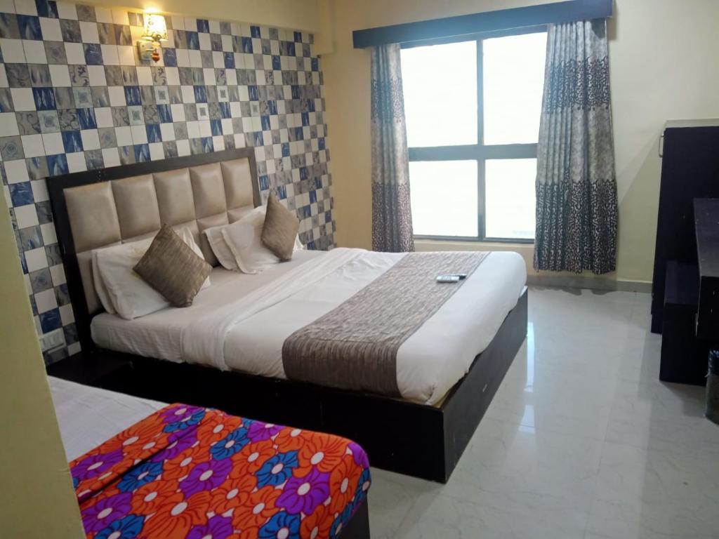 Postel nebo postele na pokoji v ubytování HOTEL DREAM INN