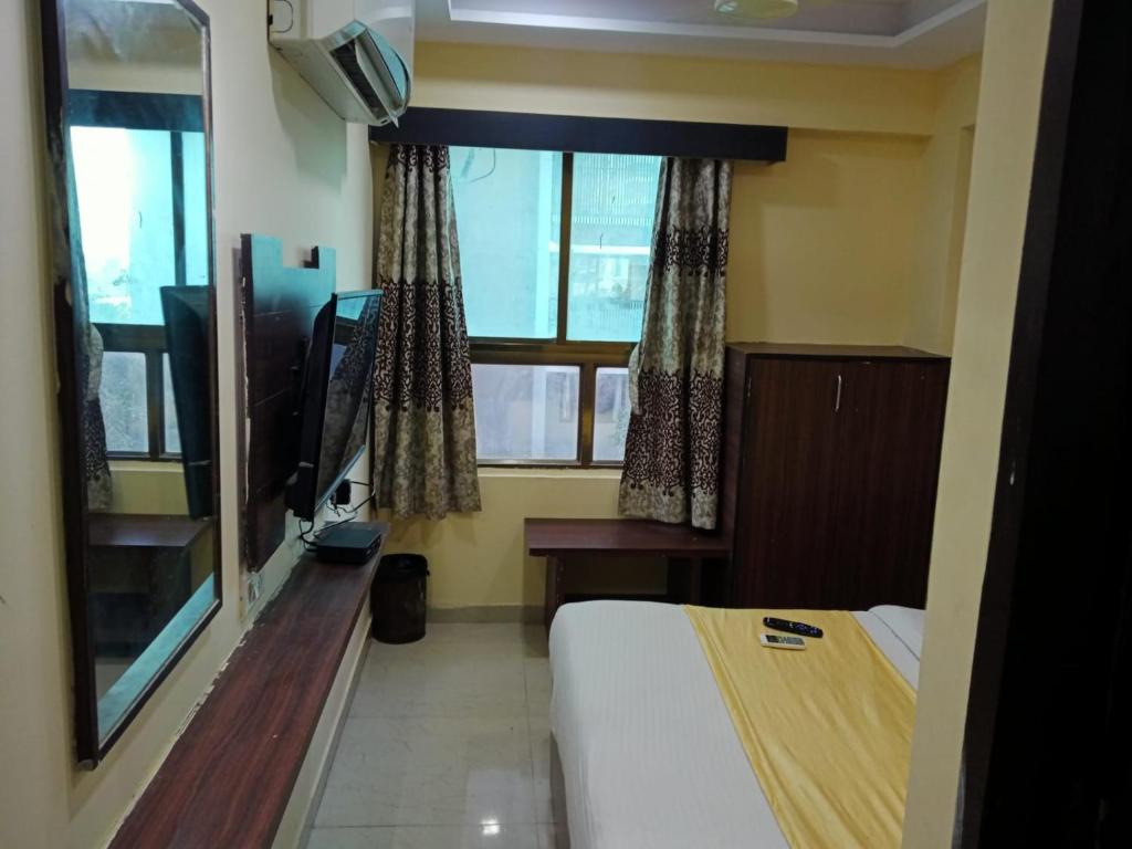Postel nebo postele na pokoji v ubytování HOTEL DREAM INN