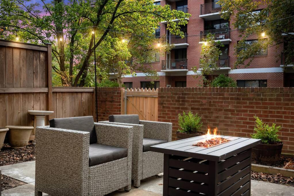 a patio with chairs and a table with a fire pit at The BEST Gorgeous & Luxurious Home Walk to Metro in Arlington