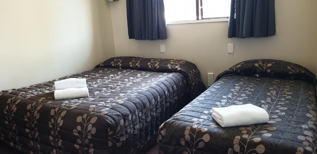 Postel nebo postele na pokoji v ubytování Commodore Motor Lodge