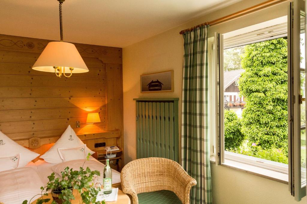 Postel nebo postele na pokoji v ubytování Garden Hotel Reinhart