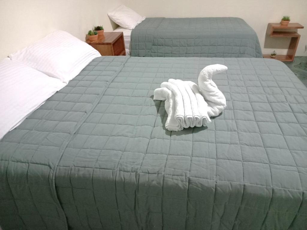 Postel nebo postele na pokoji v ubytování Chill House Flores