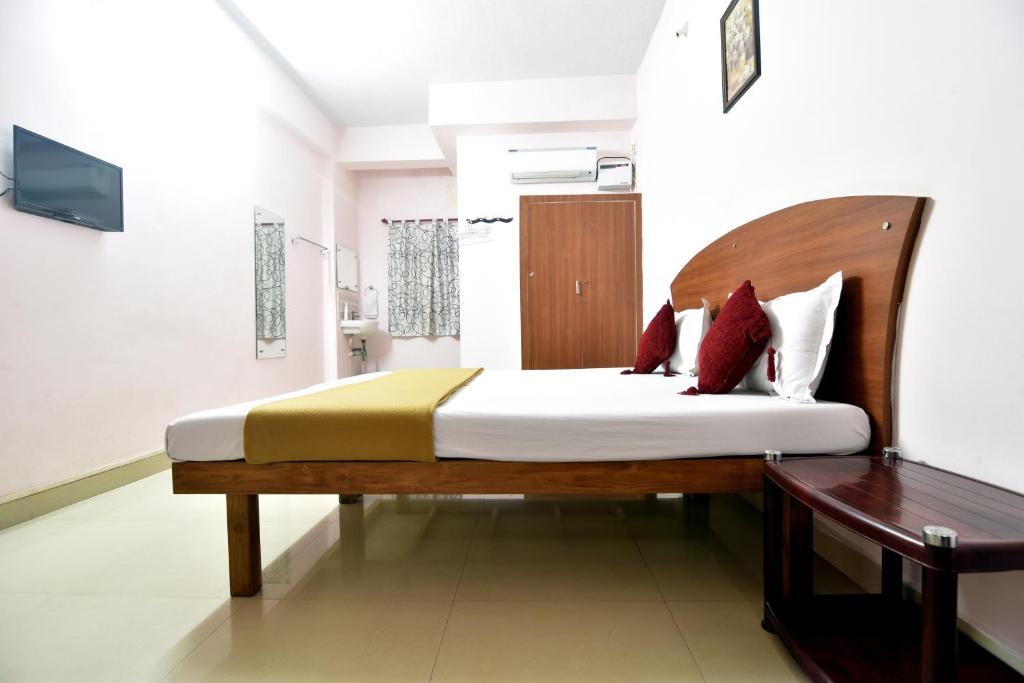 Postel nebo postele na pokoji v ubytování Royal Green Accommodation Chennai Airport