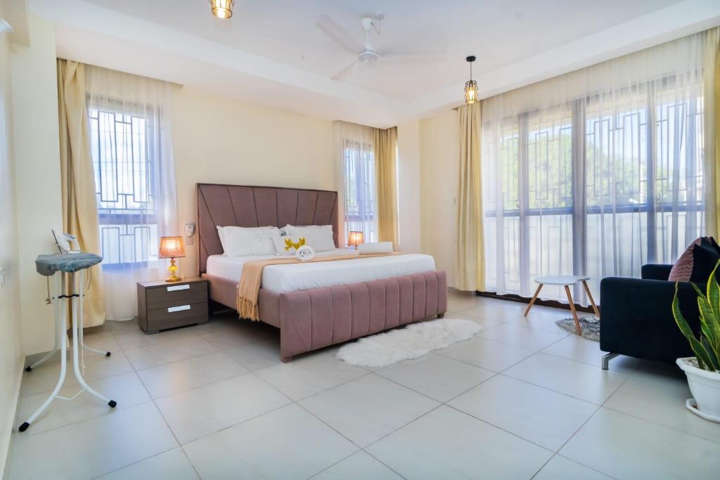 En eller flere senge i et værelse på Acacia Bee 4 Bedroom