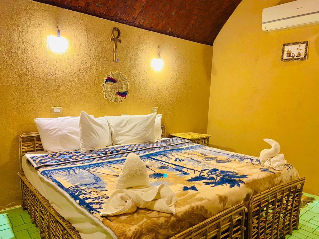 Postel nebo postele na pokoji v ubytování Kabara Nubian House