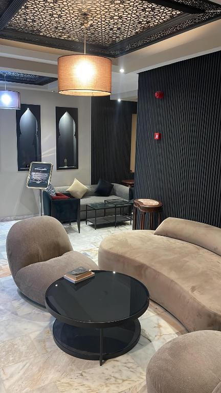 Posezení v ubytování Cadé Hotel