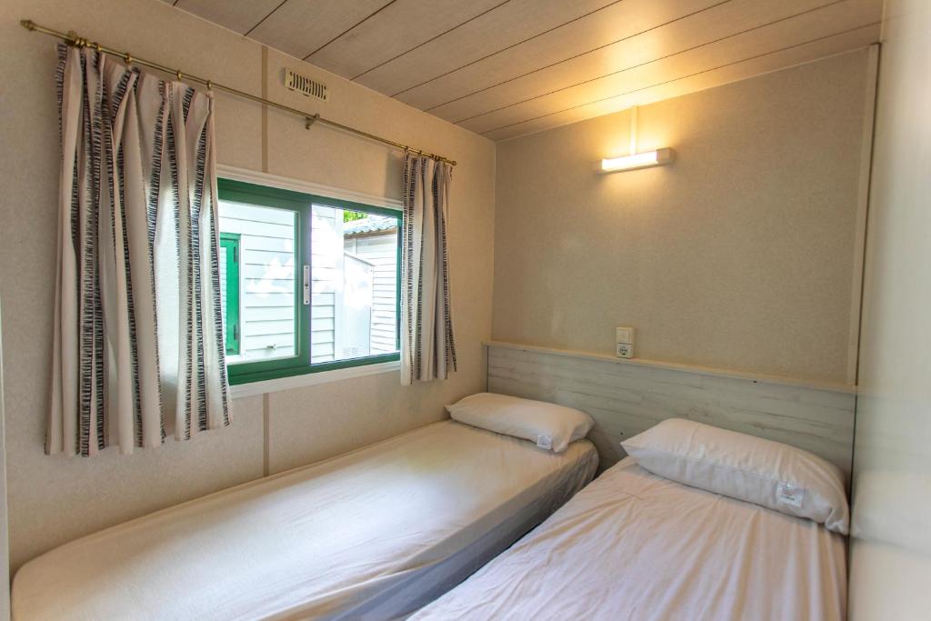 Postel nebo postele na pokoji v ubytování Camping Clarà