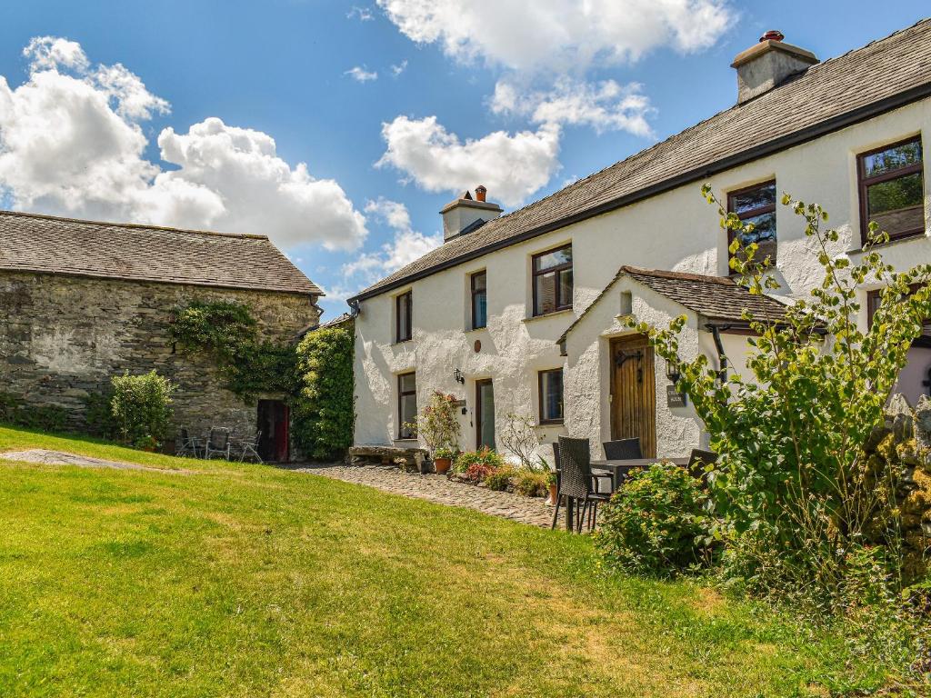 a view of the house and its yard at Church House Cottage in Ulpha