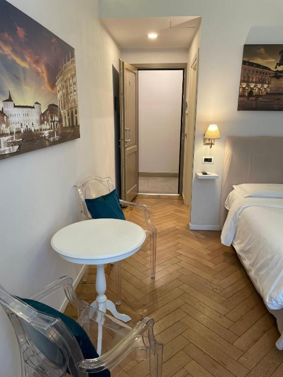 Postel nebo postele na pokoji v ubytování XX SETTEMBRE Urban Relais