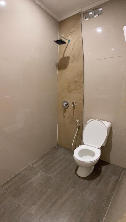 Pesona Guesthouse Syariah Malang - 豪华室