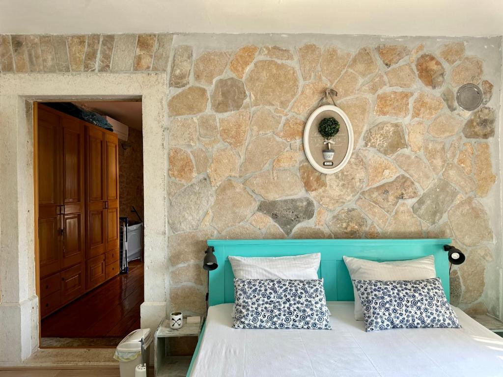 Postel nebo postele na pokoji v ubytování Il Melograno Vrbanj Hvar