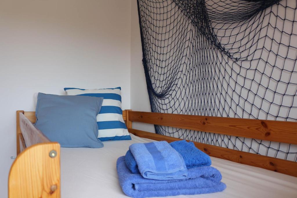 Postel nebo postele na pokoji v ubytování Il Melograno Vrbanj Hvar