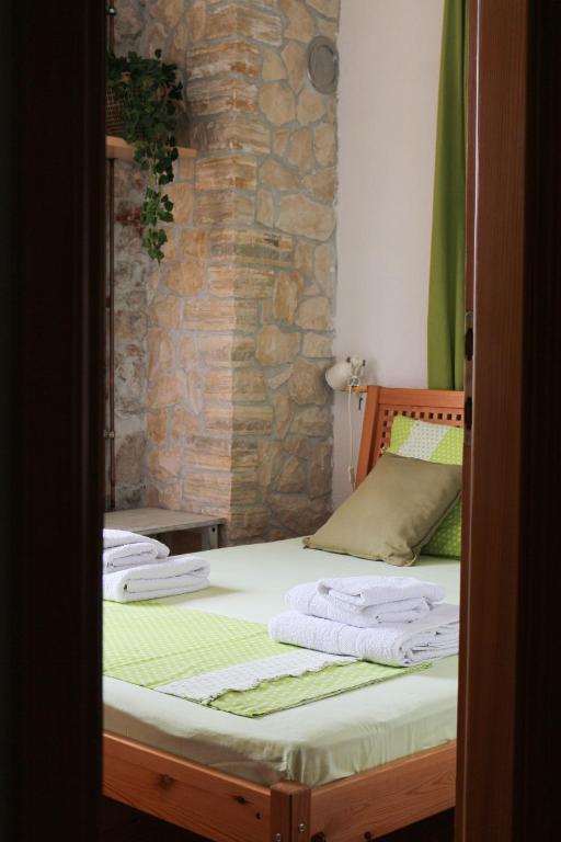 Postel nebo postele na pokoji v ubytování Il Melograno Vrbanj Hvar