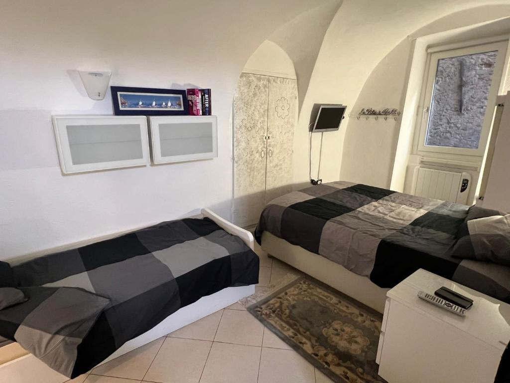 מיטה או מיטות בחדר ב-Ca' du Mangiabaggi