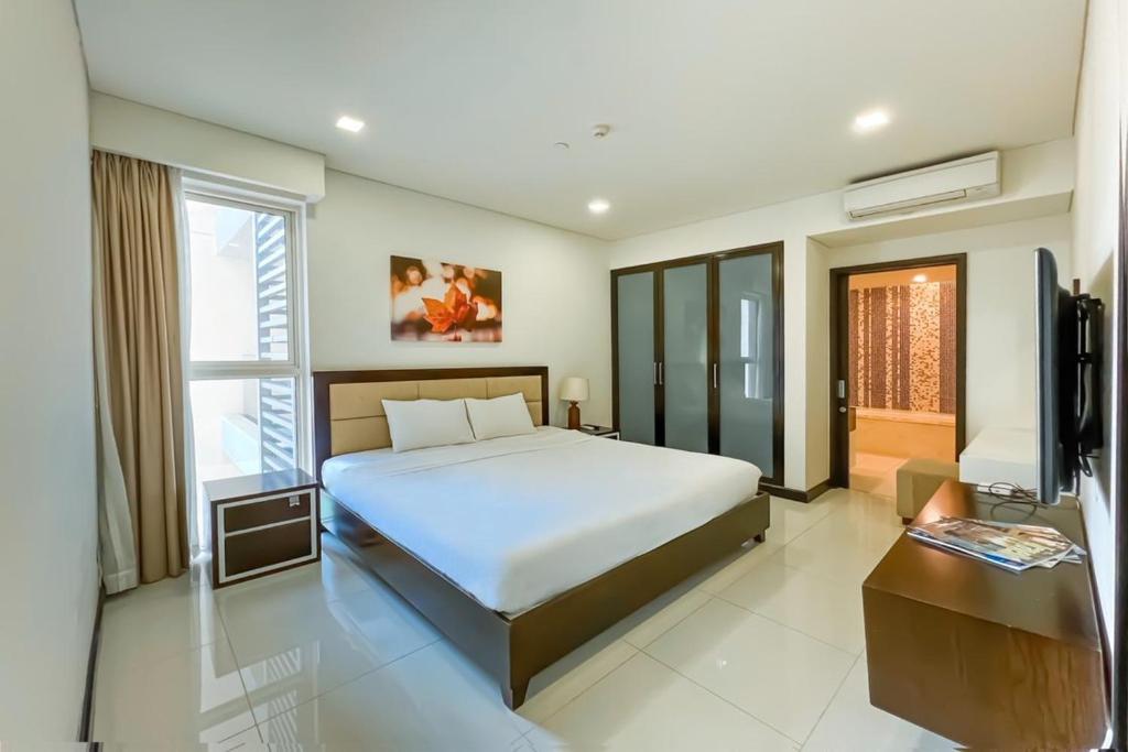 Giường trong phòng chung tại Luxury Seaview Apartments managed by Anh