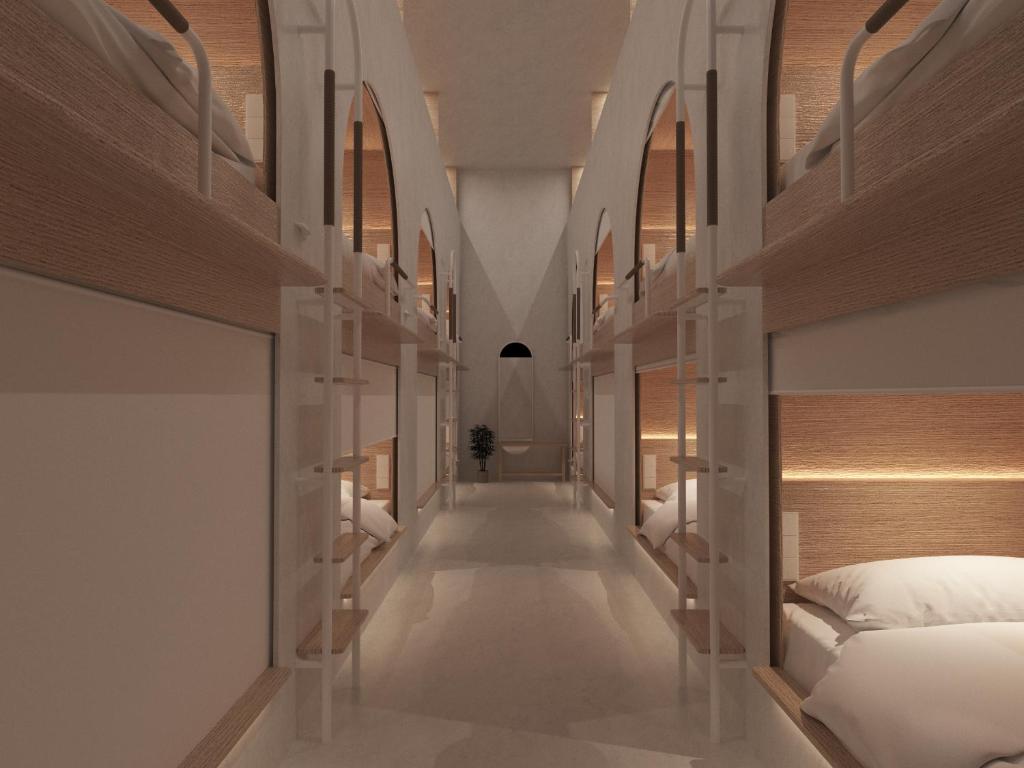 Postel nebo postele na pokoji v ubytování Literal Hotel
