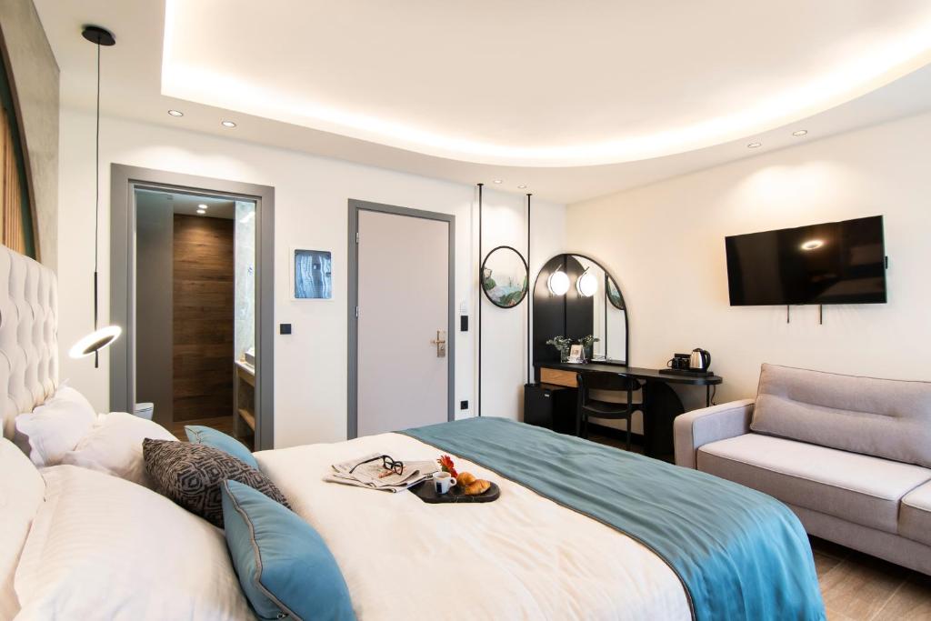 Łóżko lub łóżka w pokoju w obiekcie Thalassa Apart Hotel