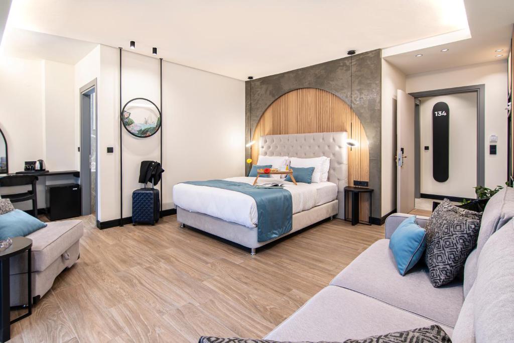 Łóżko lub łóżka w pokoju w obiekcie Thalassa Apart Hotel