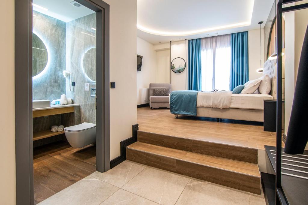 Łóżko lub łóżka w pokoju w obiekcie Thalassa Apart Hotel