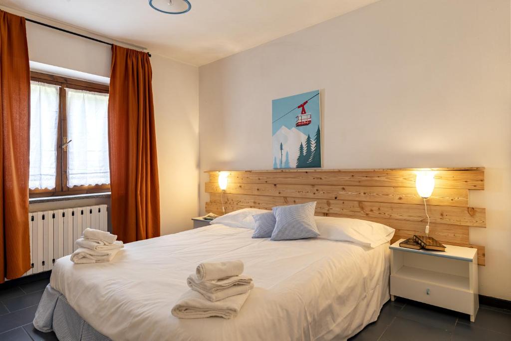 Postel nebo postele na pokoji v ubytování Aparthotel Claviere