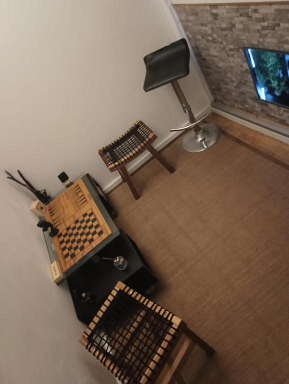 an overhead view of a room with a desk and a chair at BeauTour in Sacavém