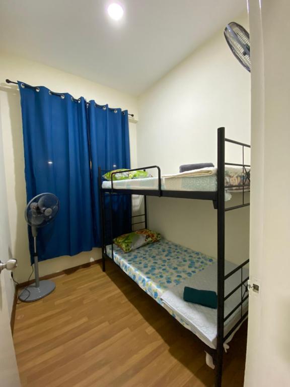 En eller flere senge i et værelse på P&B Homestay