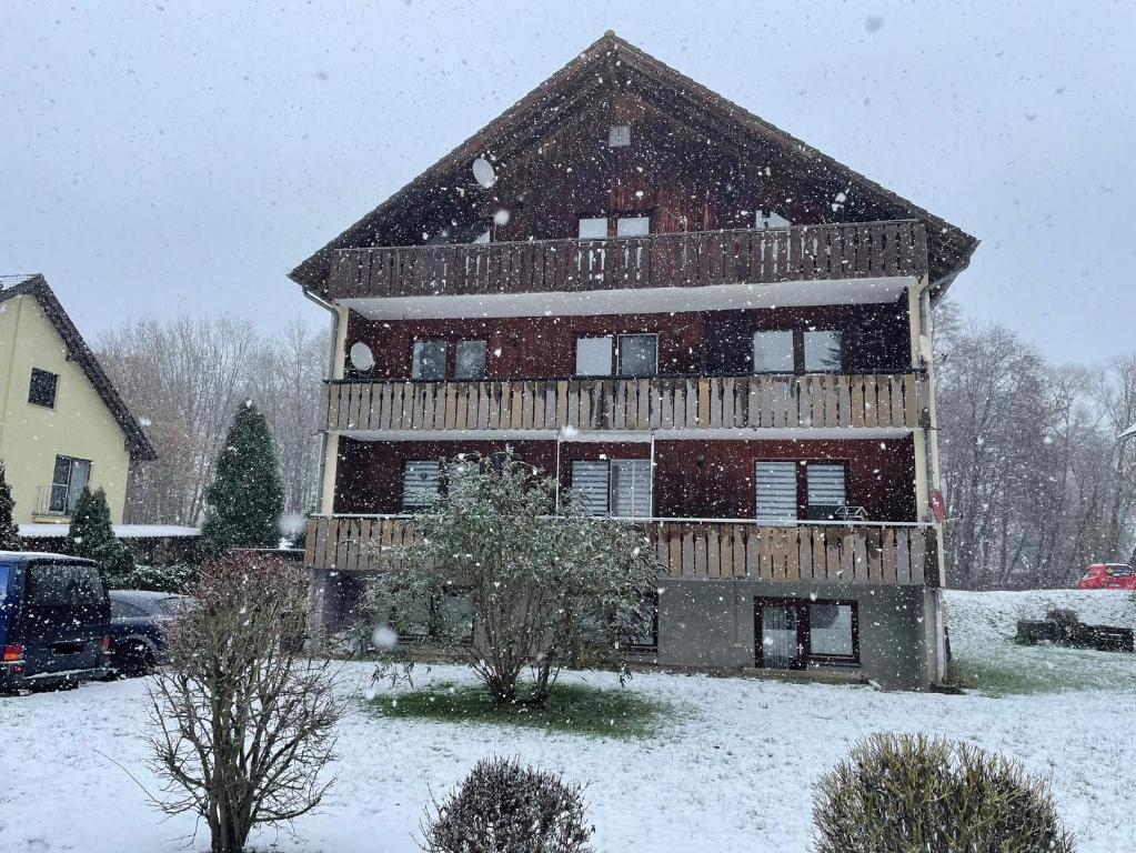 a house covered in snow in front at Henriette 1 in Walkenried