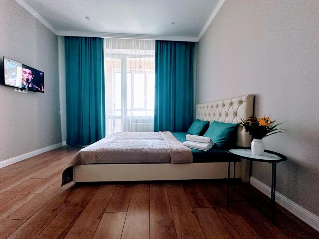 Postel nebo postele na pokoji v ubytování Отличная квартира на проспекте Туран, рядом Барыс Арена