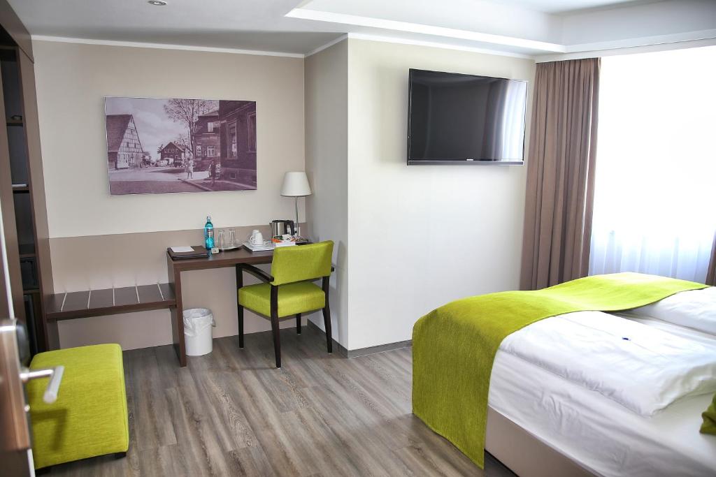 Postel nebo postele na pokoji v ubytování hotel bomonti Nürnberg West
