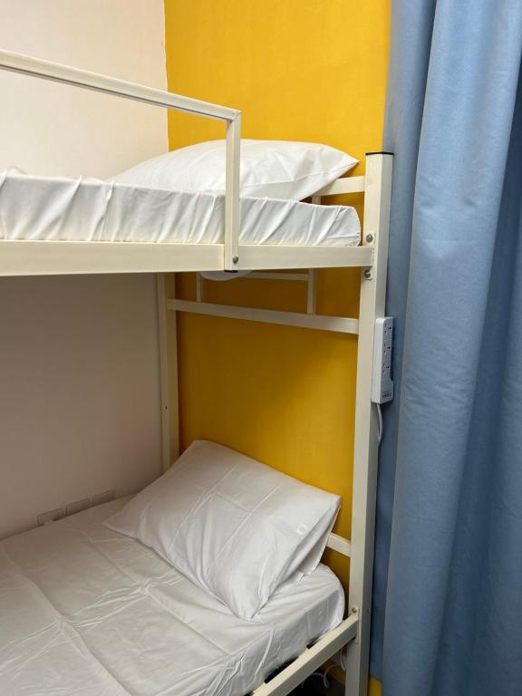Postel nebo postele na pokoji v ubytování Basil Hostel